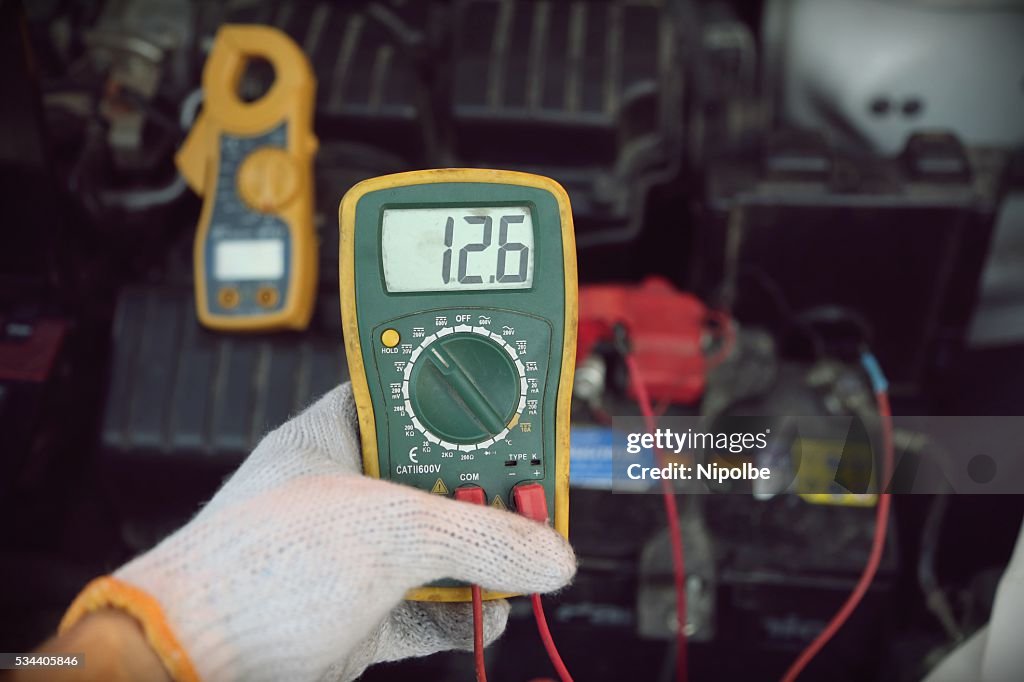 Hand holding car repair tools