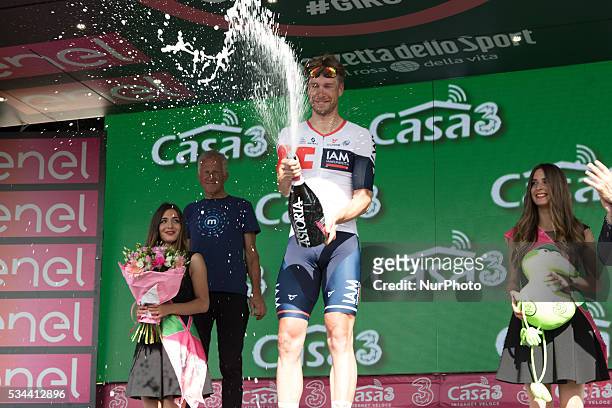 German Roger Kluge of IAM Cycling celebrates on the podium after winning the seventeenth stage in the 99th edition of the Giro d'Italia cycling race,...