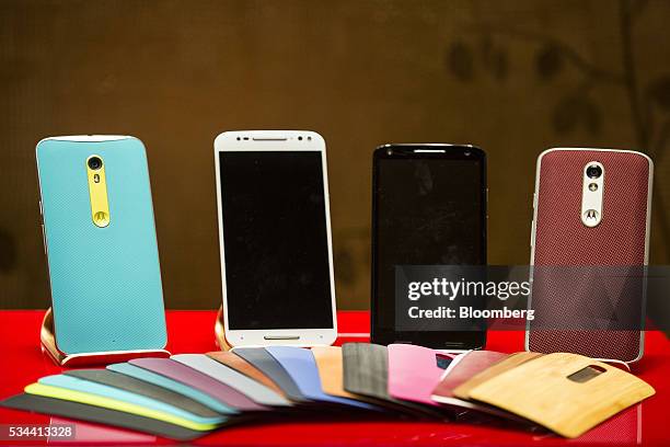 Moto smartphones by Lenovo Group Ltd. Sit on display during a news conference in Hong Kong, China, on Thursday, May 26, 2016. Lenovo posted...