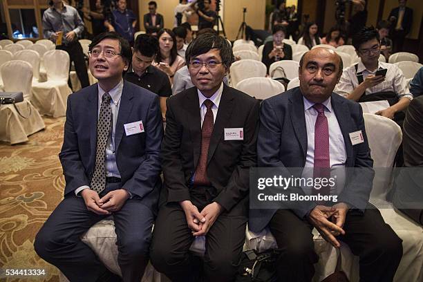 Yang Yuanqing, chairman and chief executive officer of Lenovo Group Ltd., left, Wong Wai Ming, executive vice president and chief financial officer...