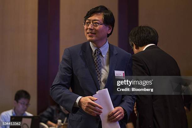 Yang Yuanqing, chairman and chief executive officer of Lenovo Group Ltd., leaves the stage after speaking during a news conference in Hong Kong,...