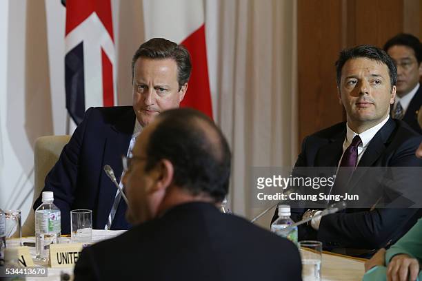 British Prime Minister David Cameron, French President Francois Hollande and Italian Prime Minister Matteo Renzi attend the Japan EU EPA/FTA meeting...
