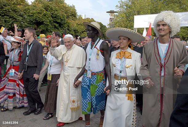 Pope Benedict XVI walks towards the Cologne Cathedral togheter with pilgrims of different nationalities on August 18, 2005 in Cologne, Germany. Pope...