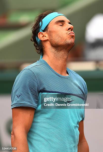 Rafael Nadal of Spain reacts during the Men's Singles second round match against Facundo Bagnis of Argentina on day five of the 2016 French Open at...