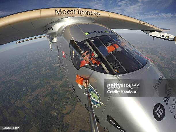 In this handout image supplied by SI2, A selfie picture showing Swiss adventurer Bertrand Piccard onboard Solar Impulse 2 during his flight from...