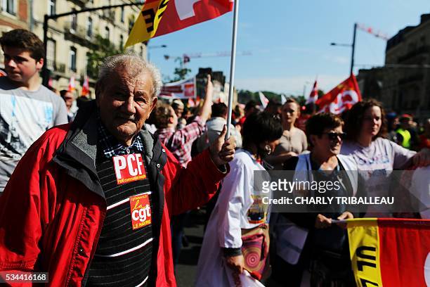People demonstrate in Le Havre northwestern France, on May 26, 2016 to protest against the government's proposed labour reforms. Refinery workers...