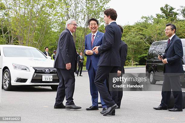 In this handout image provide by Foreign Ministry of Japan, European Commission President Jean-Claude Juncker, Japanese Prime Minister Shinzo Abe,...