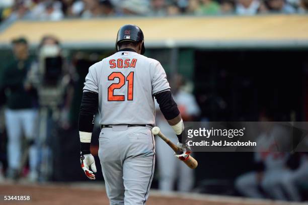 Sammy Sosa of the Baltimore Orioles walks back to the dugout against the Oakland Athletics at McAfee Coliseum on August 16, 2005 in Oakland,...