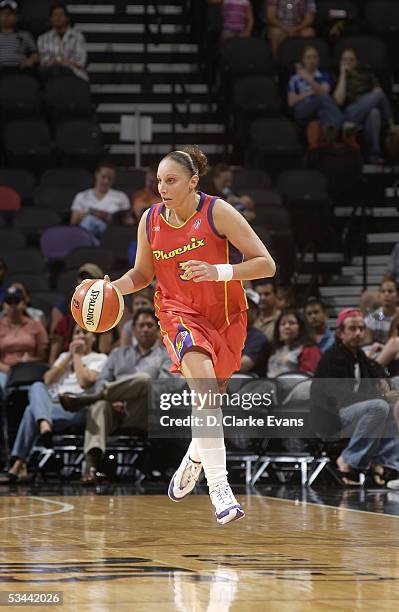 Diana Taurasi of the Phoenix Mercury moves the ball against the San Antonio Silver Stars during the WNBA game on July 23, 2005 at SBC Center in San...