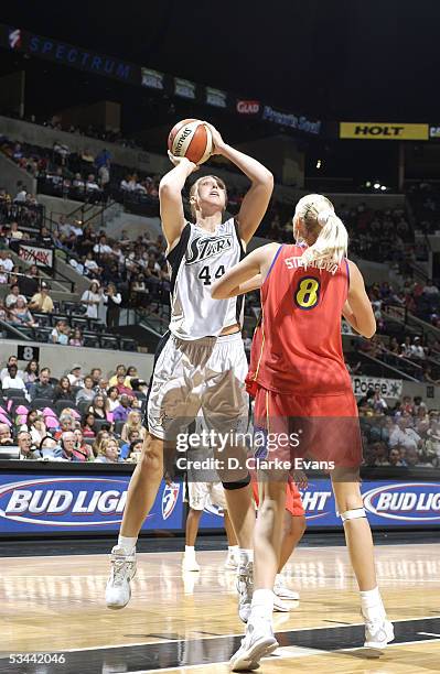 Katie Feenstra of the San Antonio Silver Stars shoots against Maria Stepanova of the Phoenix Mercury during the WNBA game on July 23, 2005 at SBC...