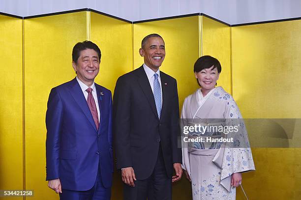 In this handout image provide by Foreign Ministry of Japan, Japanese U.S. President Barack Obama , Japan Prime Minister Shinzo Abe and wife Akie Abe...