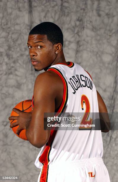 Joe Johnson of the Atlanta Hawks poses in his new uniform after being traded from the Phoenix Suns, August 19, 2005 at Philips Arena in Atlanta,...