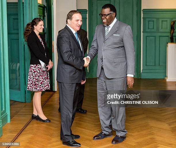 Sweden's Prime Minister Stefan Lofven greets President Hage Geingob of Namibia as he arrives on May 26, 2016 in Stockholm to the government building...