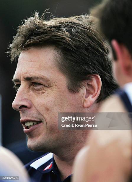 Mark Thompson, coach of the Cats addresses his players during the round twenty one AFL match between the Geelong Cats and the West Coast Eagles at...