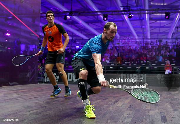 Gregory Gaultier of France competes against Omar Mosaad of Egypt during day three of the PSA Dubai World Series Finals 2016 at Burj Park on May 26,...