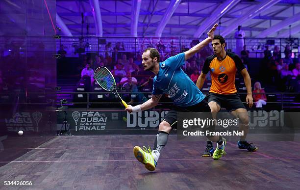 Gregory Gaultier of France competes against Omar Mosaad of Egypt during day three of the PSA Dubai World Series Finals 2016 at Burj Park on May 26,...