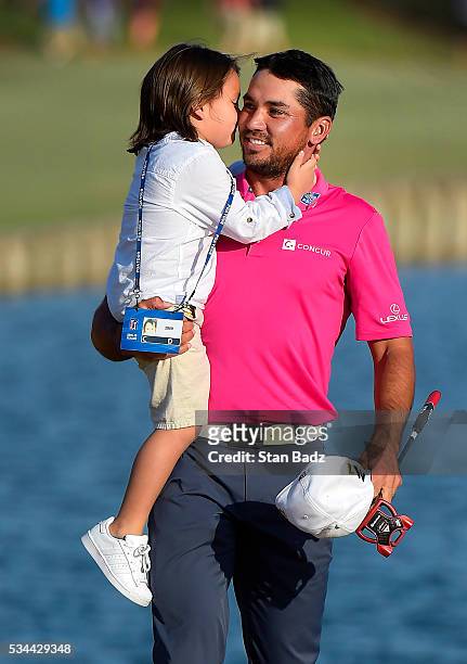Jason Day of Australia receives a kiss from his son Dash after winning during the final round of THE PLAYERS Championship on THE PLAYERS Stadium...