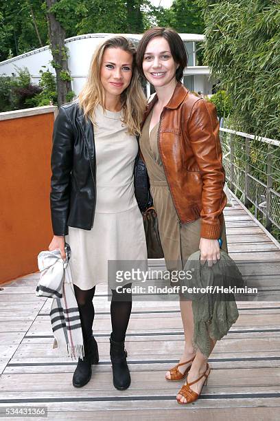 Cyclist Marion Rousse and artistic ice skater Nathalie Pechalat attend the 2016 French Tennis Open - Day Five at Roland Garros