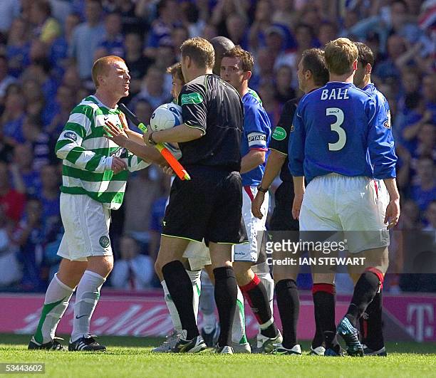 Glasgow, UNITED KINGDOM: Neil Lennon argues with match officials after being red carded by referee Stuart Dougal 20 August 2005 during the Rangers v...