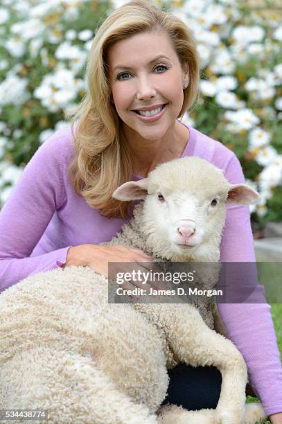 Catriona Rowntree poses with a sheep to celebrate her relationship with The Wool Industry on October 8, 2012 in Sydney, Australia