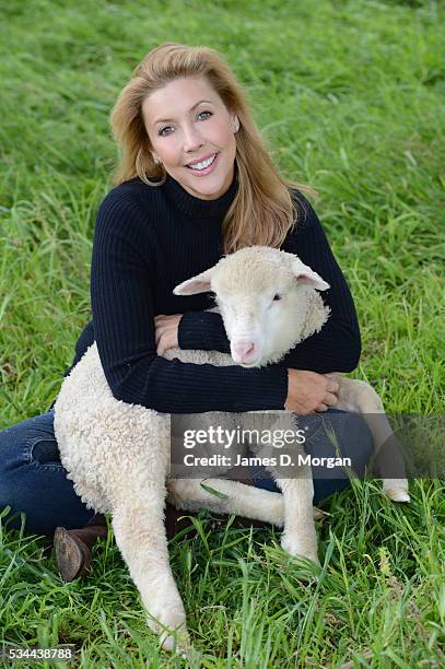 Catriona Rowntree poses with a sheep to celebrate her relationship with The Wool Industry on October 8, 2012 in Sydney, Australia