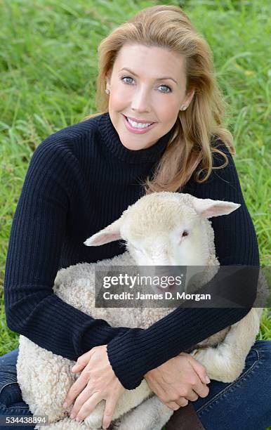 Catriona Rowntree poses with a sheep to celebrate her relationship with The Wool Industry on October 8, 2012 in Sydney, Australia