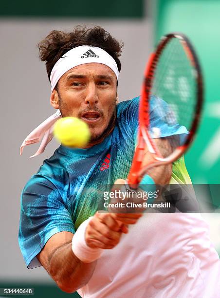 Juan Monaco of Argentina hits a background during the Men's Singles second round match against David Ferrer of Spain on day five of the 2016 French...