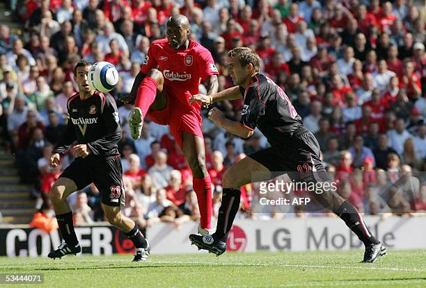Liverpool, UNITED KINGDOM: Liverpool's Djibril Cisse challenges for the ball with Sunderland's Alan Stubbs during the Premiership match between...