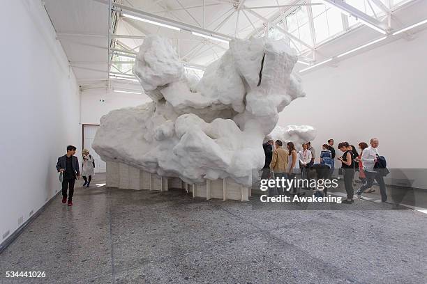 People attend at the Switzerland Pavillion of the 15th Architecture Venice Biennale, on May 26, 2016 in Venice, Italy. The 15th International...