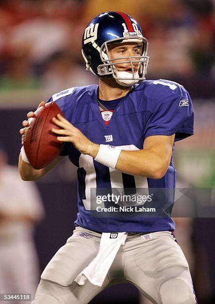 Quarterback Eli Manning of the New York Giants looks to pass against the Carolina Panthers during their preseason game on August 20, 2005 at Giants...