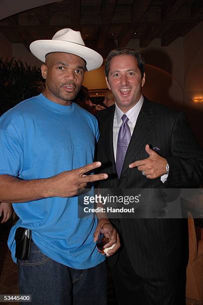 In this handout from International Pool Tour, rapper Darryl McDaniels of Run DMC and writer Kevin Trudeau are seen at the pre-party for the...