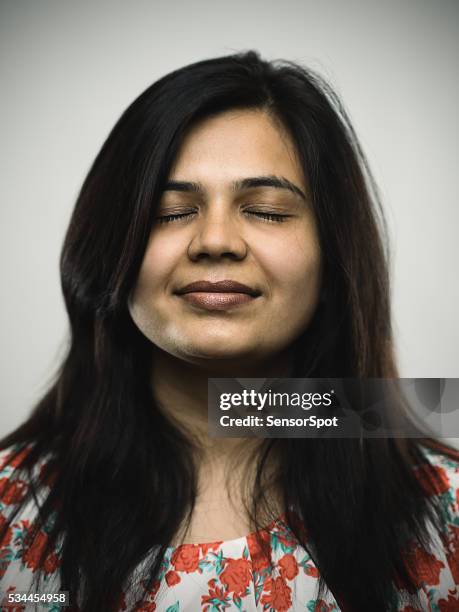 portrait of a young indian woman with relaxed expression - fat woman sleeping stock pictures, royalty-free photos & images