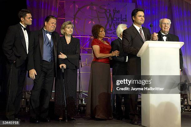 Performer Donny Osmond and his father George accept a Humanitarian award on behalf of George's deceaced wife Olive at the 5th annual Starkey...