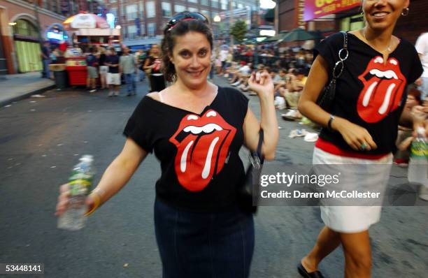 Concert goers dress for the occasion on opening night of the Rolling Stones "A Bigger Bang" tour August 21, 2005 in Boston, Massachusetts. The 37...