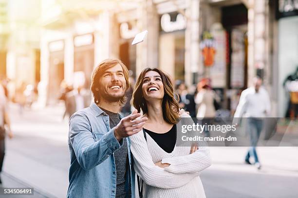 young couple in istanbul - throwing phone stock pictures, royalty-free photos & images