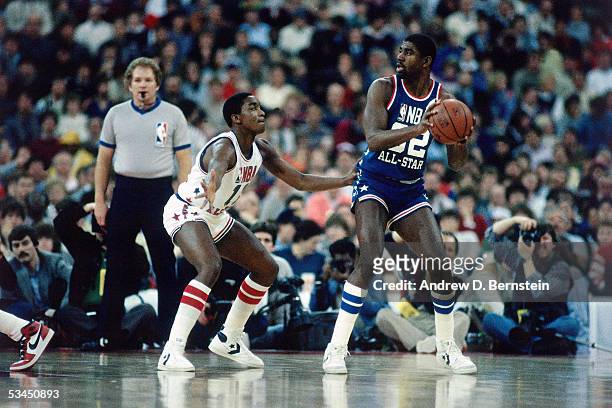 Magic Johnson of the Western Conference All-Stars looks to pass against the Isiah Thomas of the Eastern Conference All-Stars during the 1985 NBA...