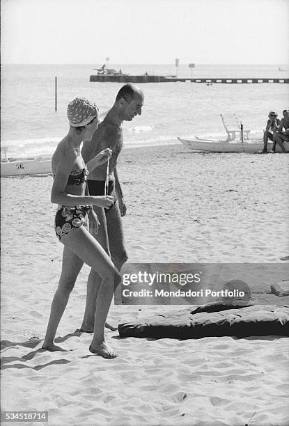 Italian journalist Indro Montanelli at the beach during the 19th Venice International Film Festival. Venice, August 1958