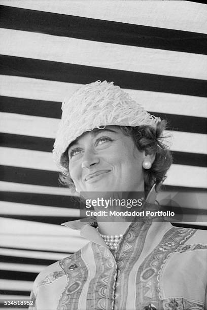 Italian baroness Afdera Franchetti, wife to American actor Henry Fonda, smiling during the XVIII Venice International Film Festival. Venice, 1957