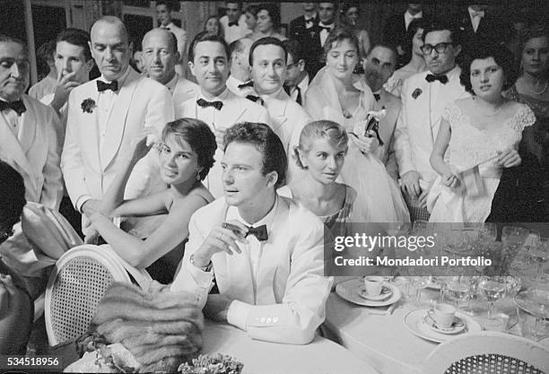 Italian actor Franco Interlenghi and his wife, Italian actress Antonella Lualdi, sitting a the table during the XVIII Venice International Film...