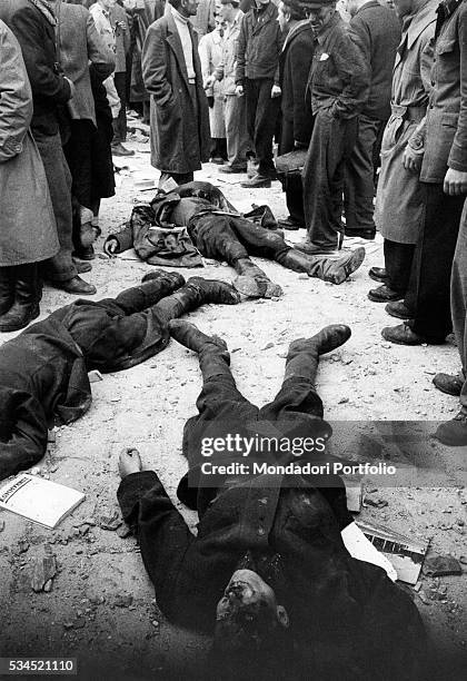 After the battle for the headquarters of the Communist Party, on the ground remain the bodies of Hungarian secret police agents . Next to them, some...