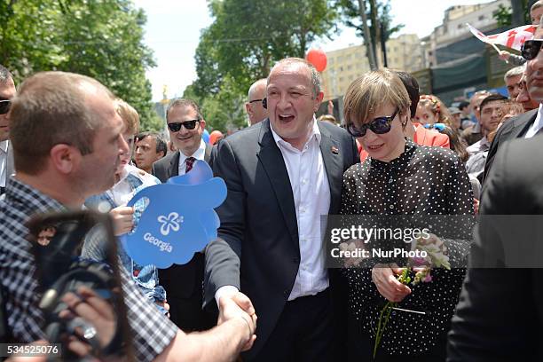 Giorgi Margvelashvili, the President of Georgia, and Georgia First Lady, Maka Chichua, meet with people in Tbilisi center, as many people of all age...