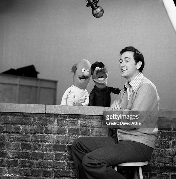 Actor and singer Bob McGrath with 'Anything Muppets' postman and dentist rehearses for an episode of Sesame Street at Reeves TeleTape Studio in 1970...