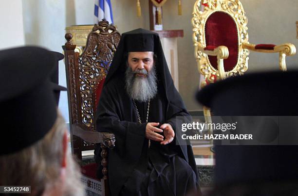 The new Greek Orthodox Patriarch of Jerusalem, Theofilos, receives people's congratulation 23 August 2005 at a church in Jerusalem. Former patriarch...