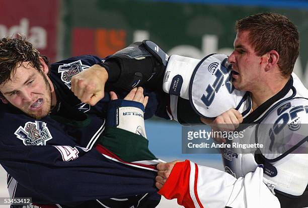 Marty Doyle of the Shawinigan Cataractes and David Starenky of the Gatineau Olympiques fight during the Quebec Major Junior Hockey game at...