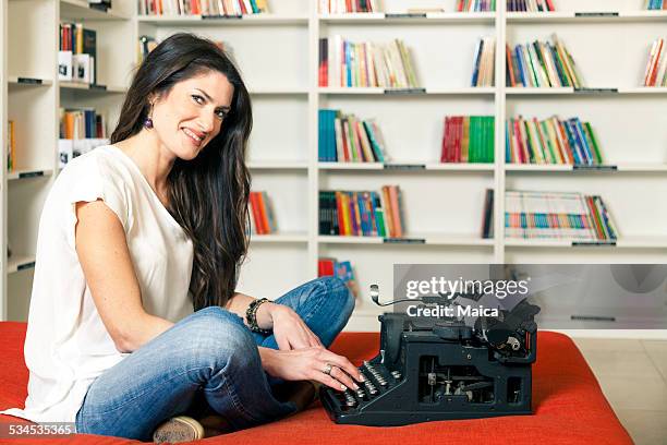 happy woman typing - female authors stock pictures, royalty-free photos & images