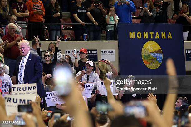 Republican presidential candidate Donald Trump walks onto stage at a rally on May 26, 2016 in Billings, Montana. According to a delegate count...