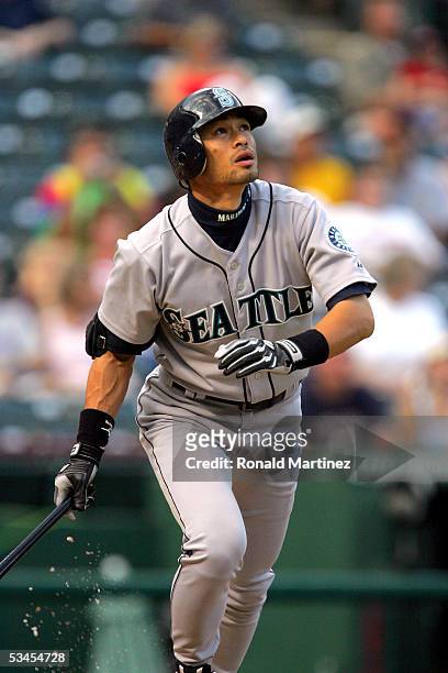 Ichiro Suzuki of the Seattle Mariners watches his solo homer un against the Texas Rangers in the first inning on August 23, 2005 at Ameriquest Field...