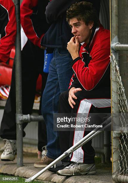 Injured Leigh Fisher of the Saints watches on during the St.Kilda Saints training session at Moorabbin Oval on August 24, 2005 in Melbourne,...