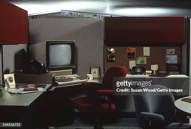 View of desk with a computer in a modular office, April 1984. The photo was taken as part of a shoot for the Herman Miller Furniture brochure.