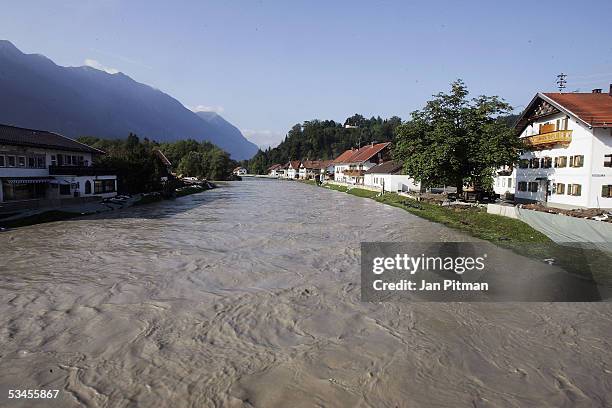 The Loisach river is seen with high water levels on August 24, 2005 in Eschenlohe, Germany. People in southern Bavaria are cleaning up the streets...